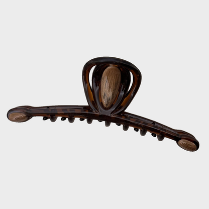 Amber Beau - Caramel Loop Long Hair Claw on neutral background