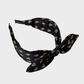 Black Gifty - Paisley Rabbit Ear Knotted Headband on neutral background