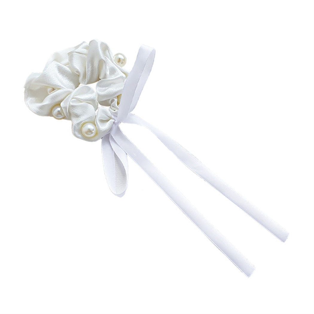White beaded bow scrunchie on a white background