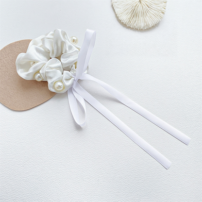 White beaded bow scrunchie with trailing ribbons