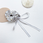 Gray beaded bow scrunchie with trailing ribbons